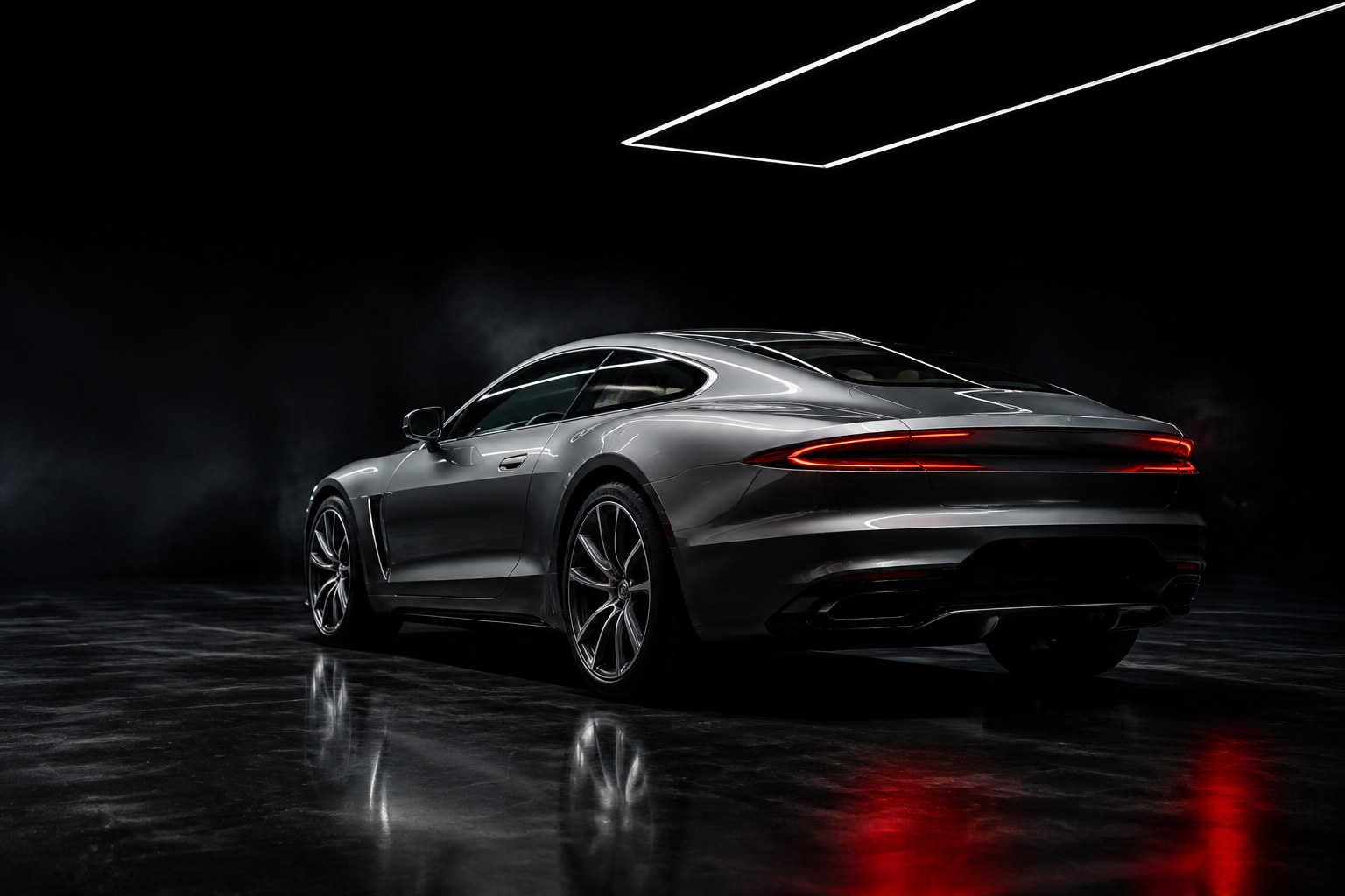 Silver luxury sports car in a dramatic dark architectural setting